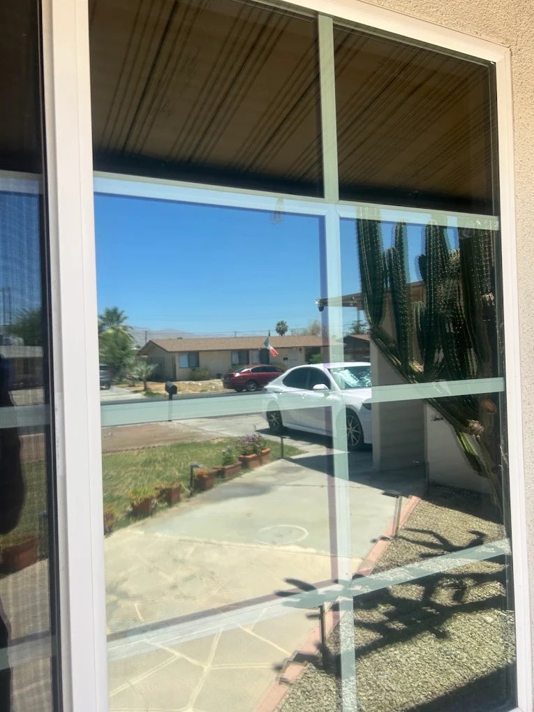 Freshly cleaned window in Indio — spotless glass with a crystal-clear reflection